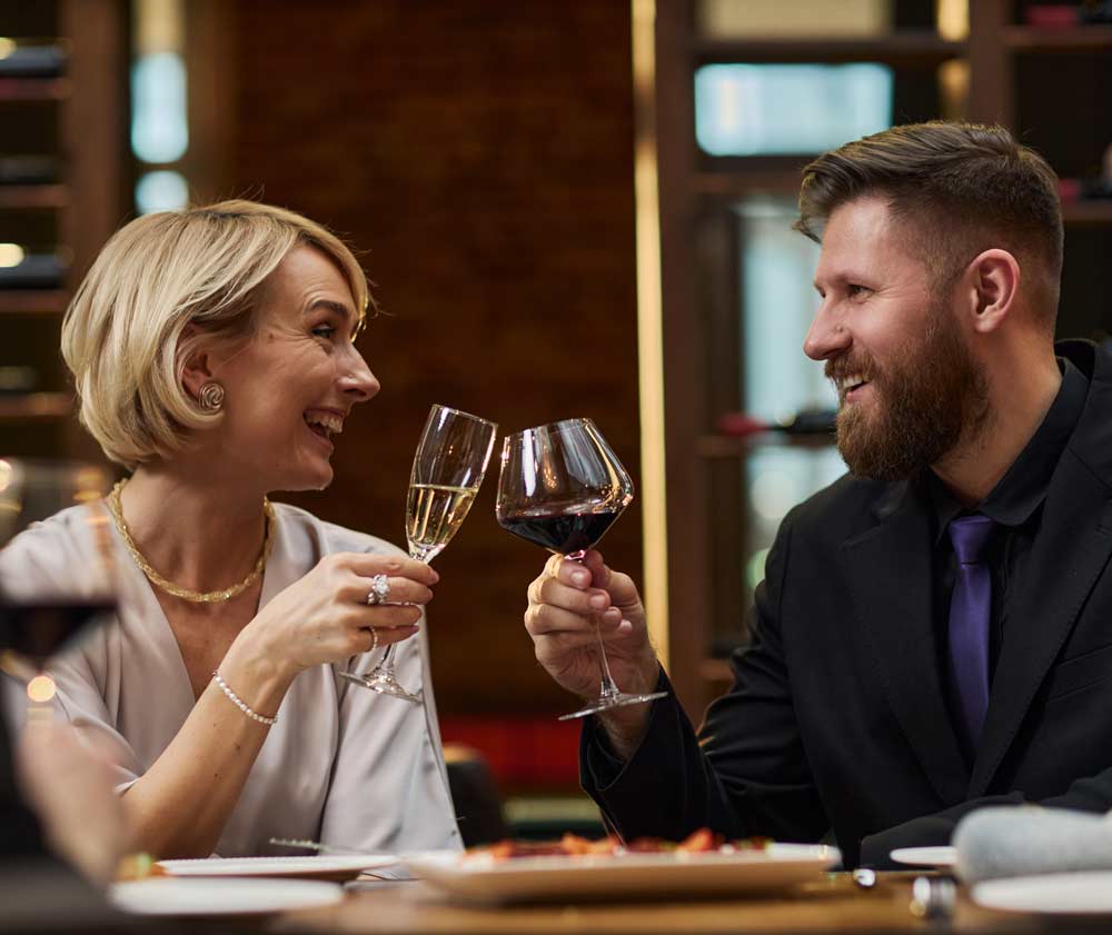 elegant-couple-celebrate-with-wine-in-fine-restaur-2026-04-17-22-33-33-utc