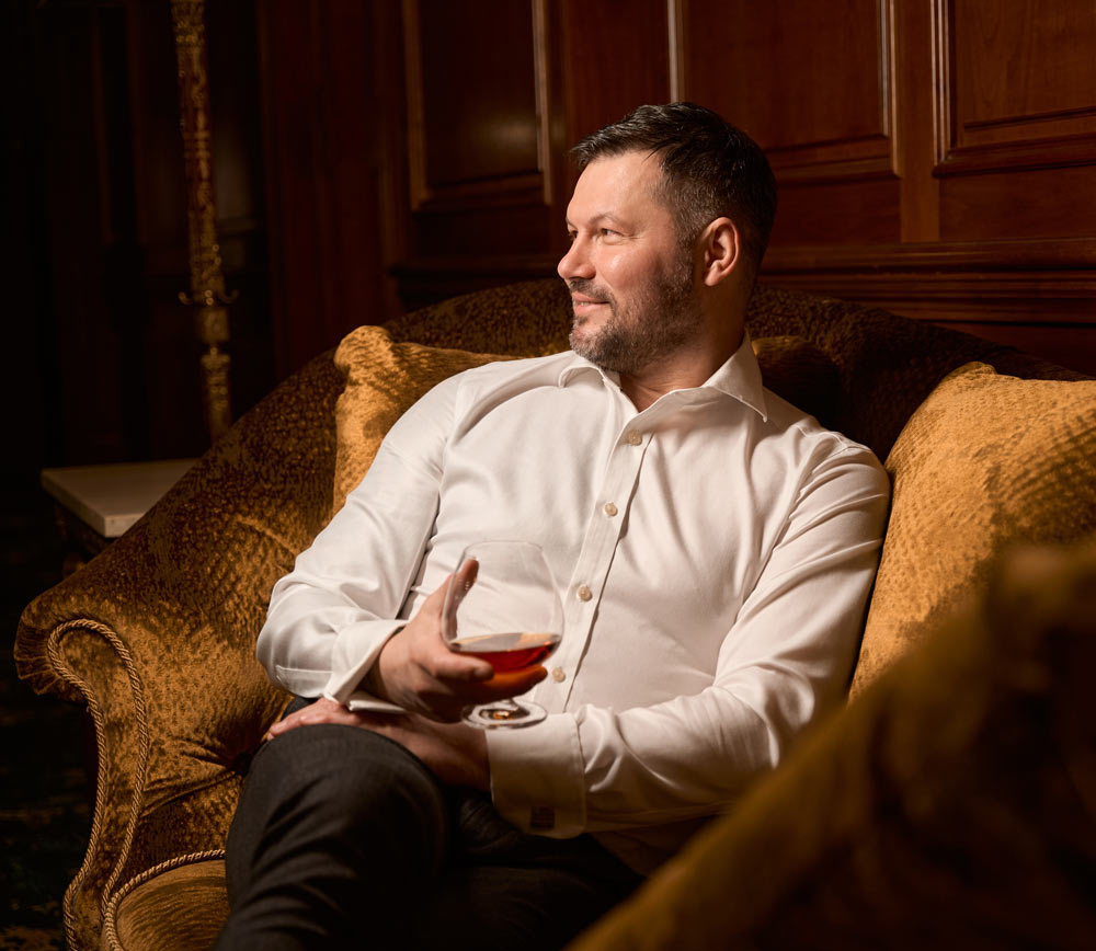 male-guest-sitting-with-glass-of-expensive-cognac-2026-03-19-10-38-22-utc